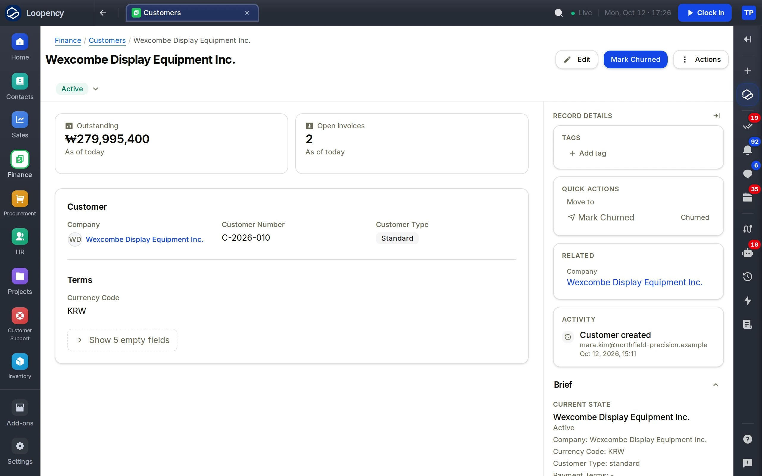 A customer's page: outstanding balance, open invoices, the customer's details, and its brief and activity